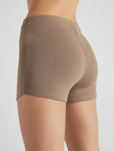 model wears light brown 3 inch inseam rib shorts