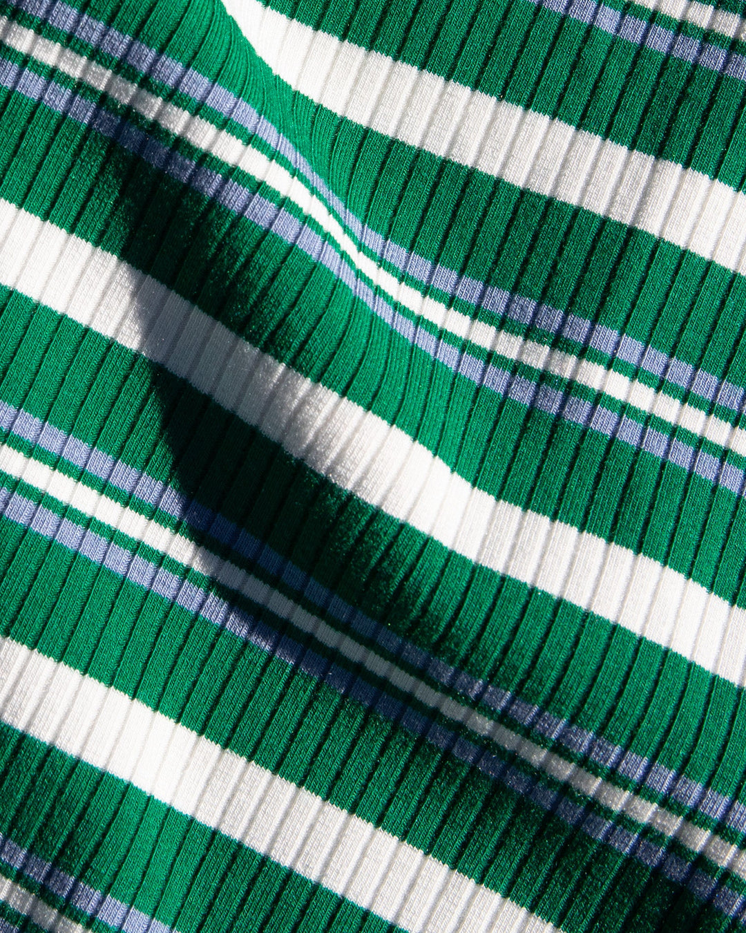 Close-up of the LSPACE Lisette Dress in ashbury stripe, highlighting the ribbed green, white, and blue stripe fabric texture.
