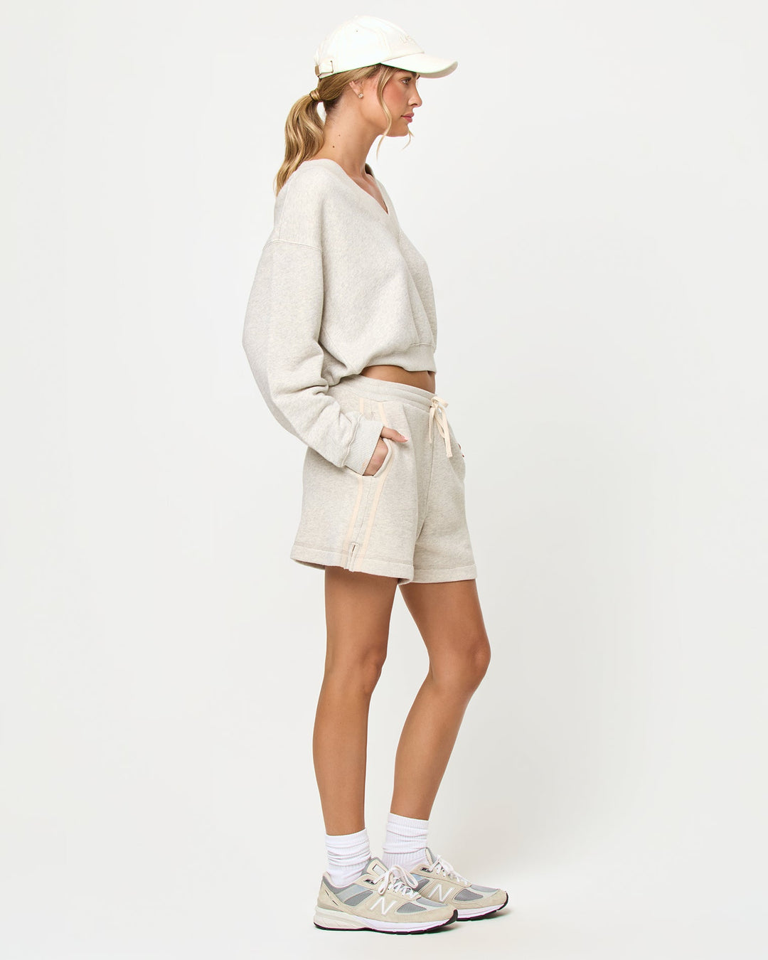 LSPACE Vaughn sweatshirt and Bennett Short in heather gray, side view on model.