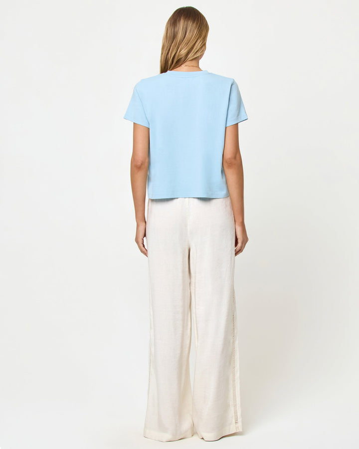 LSPACE All Day top in sky blue, back view on model.