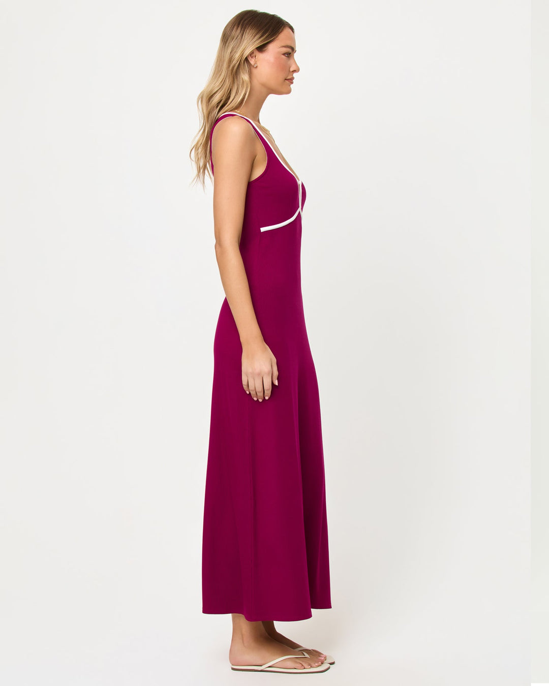 Side view of model wearing the LSPACE Sayge Maxi in berry jam cream.