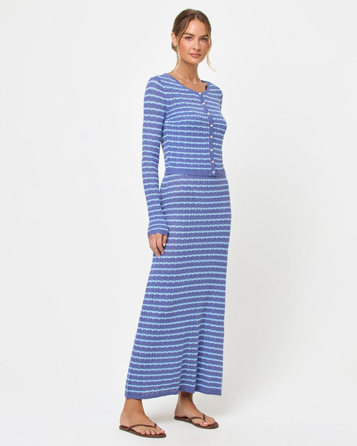LSPACE Rosalie maxi dress in blue lagoon, styled with cardigan, side view on model.