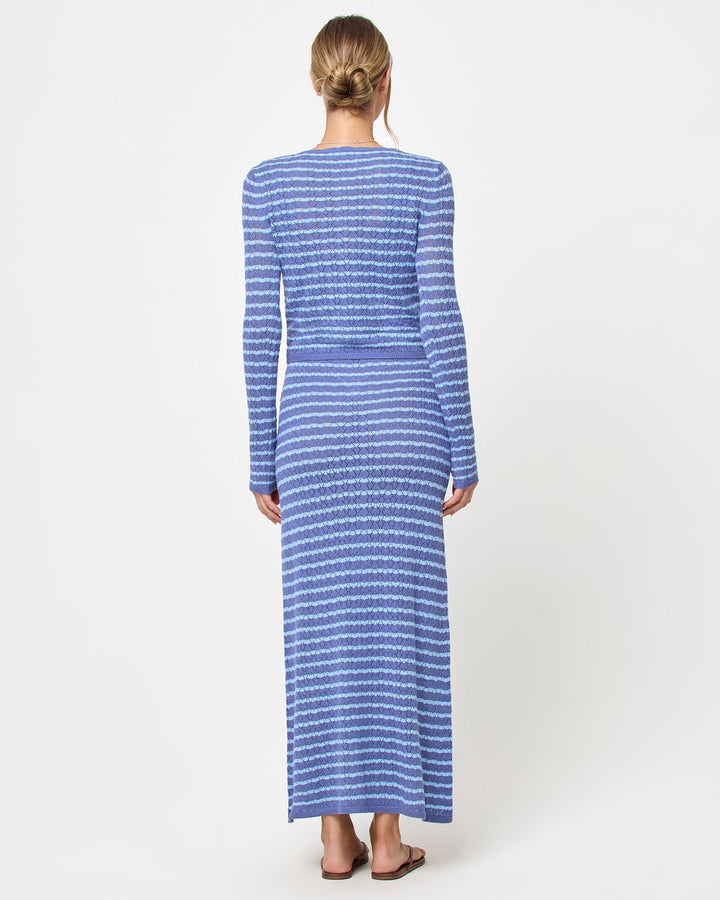 LSPACE Rosalie maxi dress in blue lagoon, styled with cardigan, back view on model.