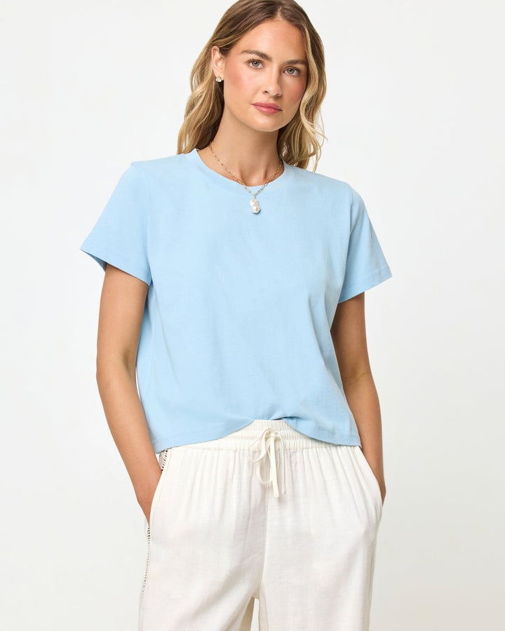 LSPACE All Day top in sky blue, close-up detail view on model.