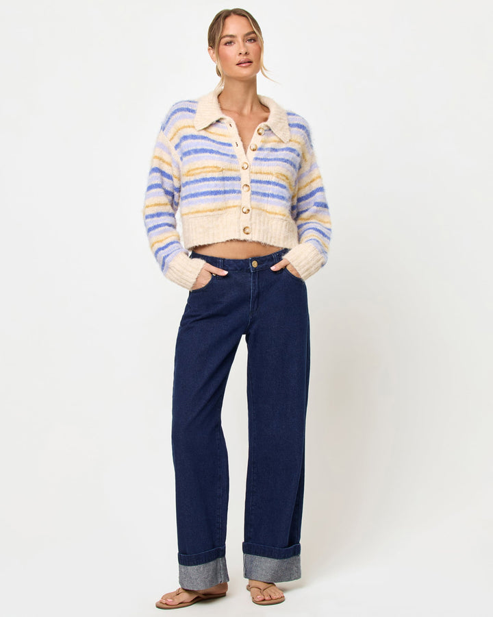 LSPACE Rumi sweater in seaside stripe, styled with jeans, front view on model.