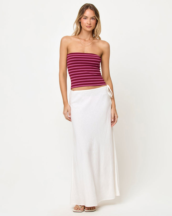 LSPACE Zinnia Top in Sipping Sangria Stripe, front view on model styled with white maxi skirt.