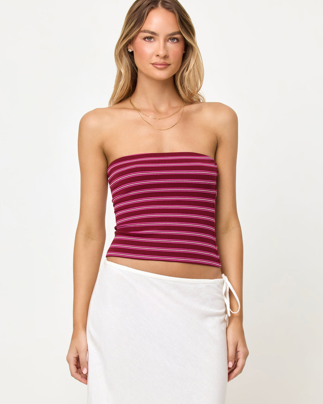 LSPACE Zinnia Top in Sipping Sangria Stripe, close-up front view on model.