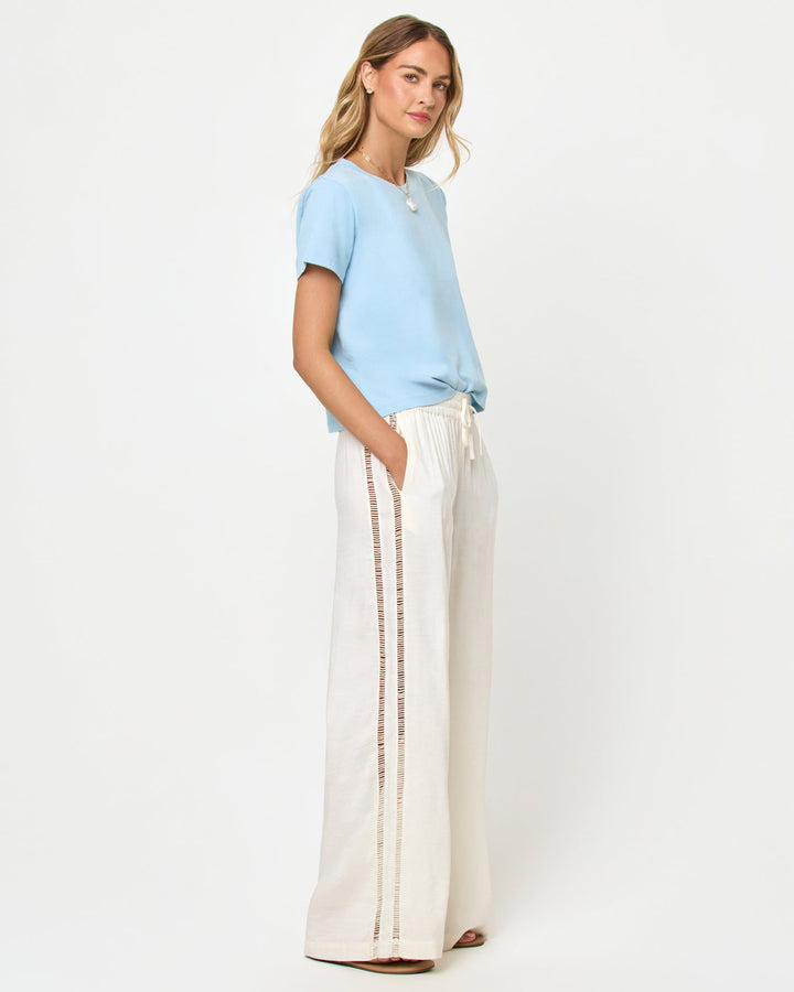 LSPACE All Day top in sky blue, side view on model.