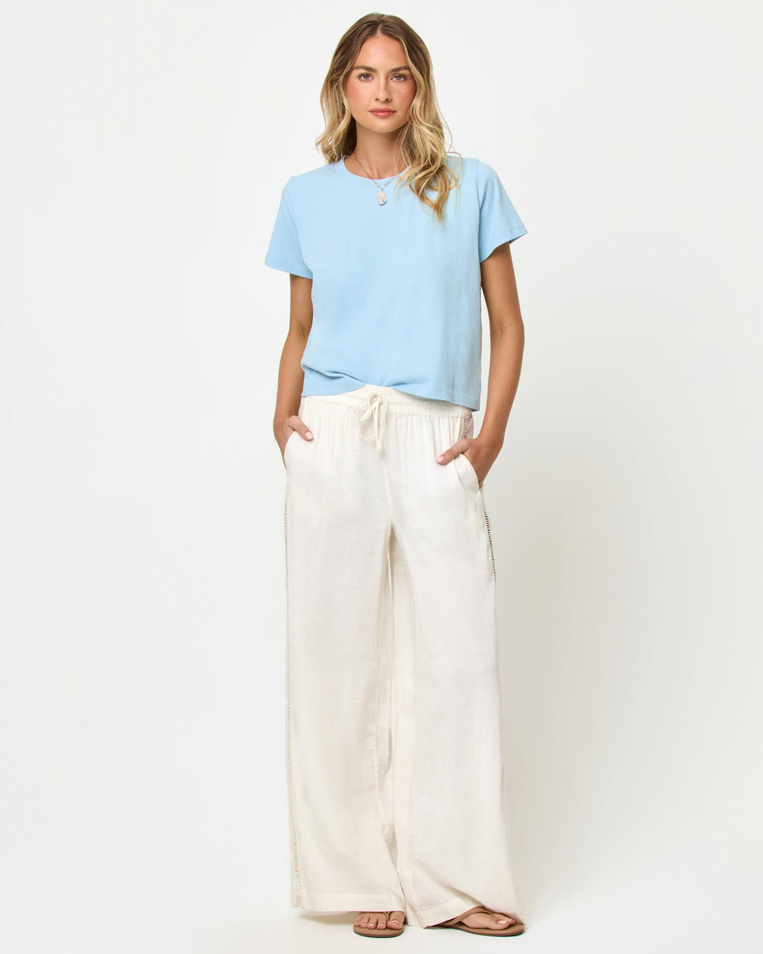 LSPACE All Day top in sky blue, front view on model.