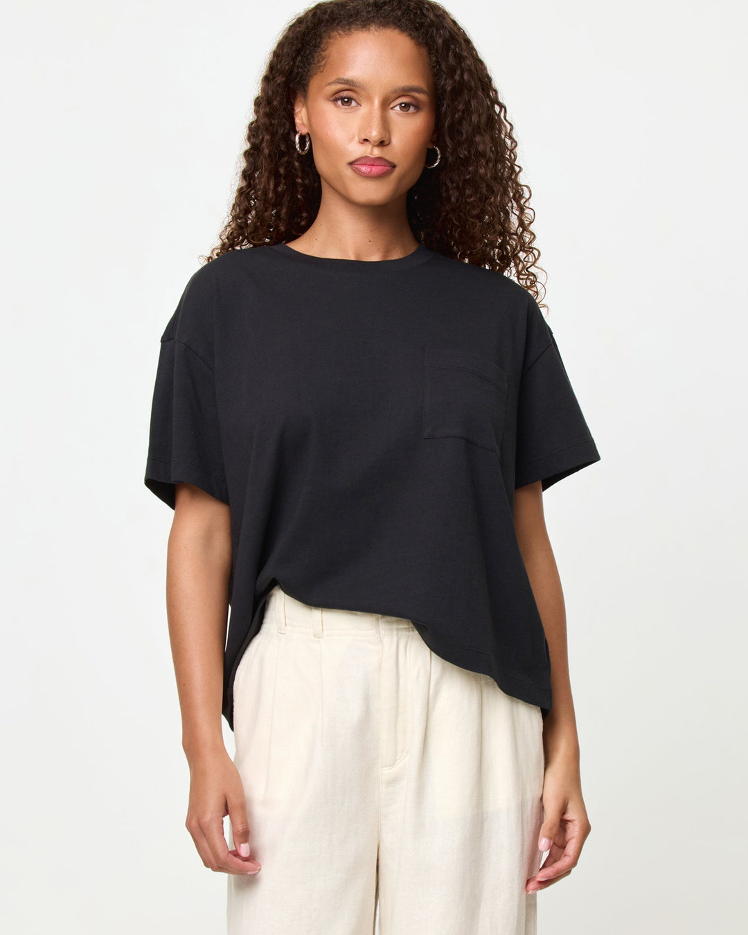 LSPACE Everyday tee in black, close-up detail view on model.