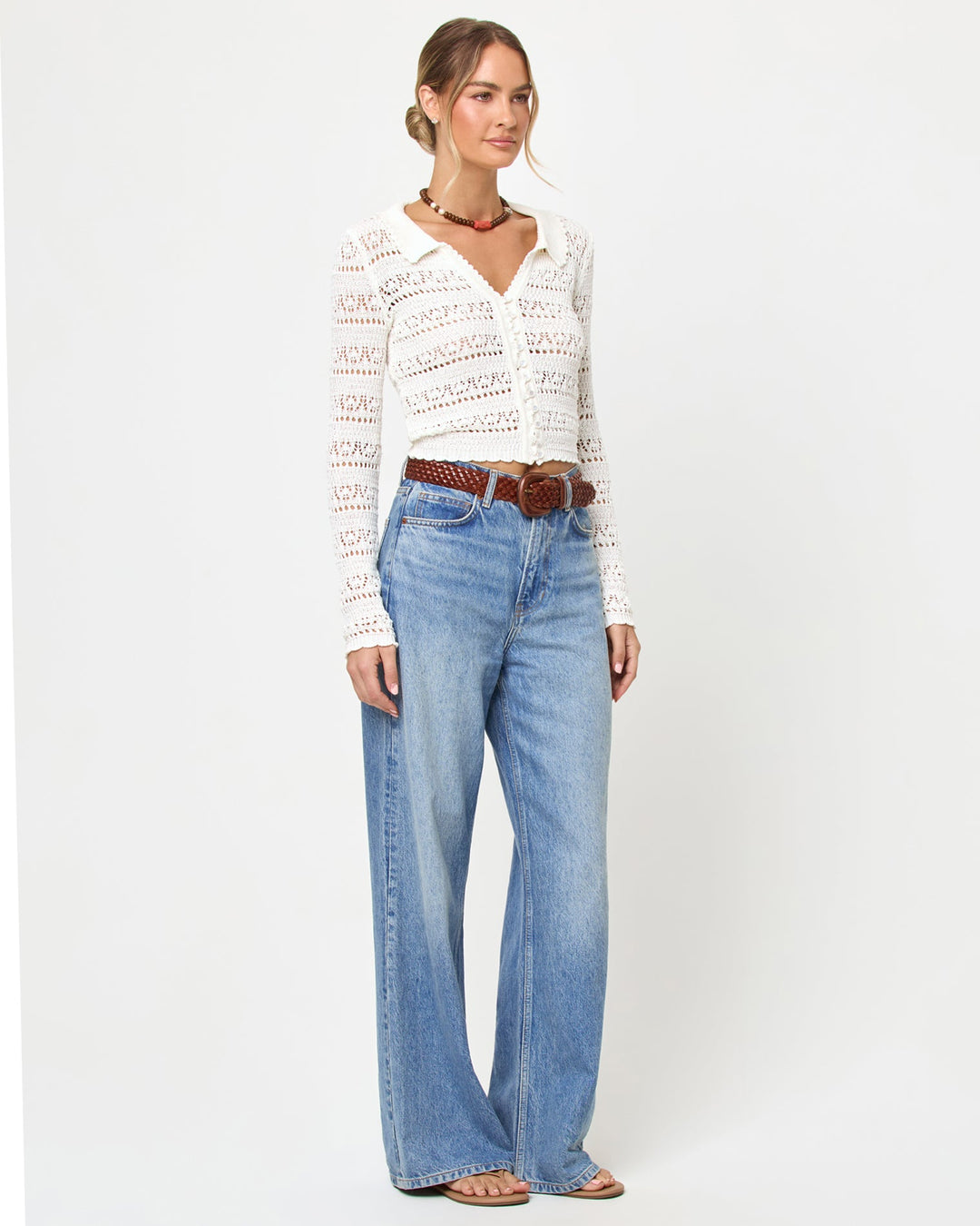 LSPACE Leighton sweater in Cream, three-quarter view on model.