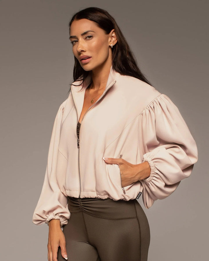 Side view of the Onyx Jacket in Nude Pink showing the oversized fit