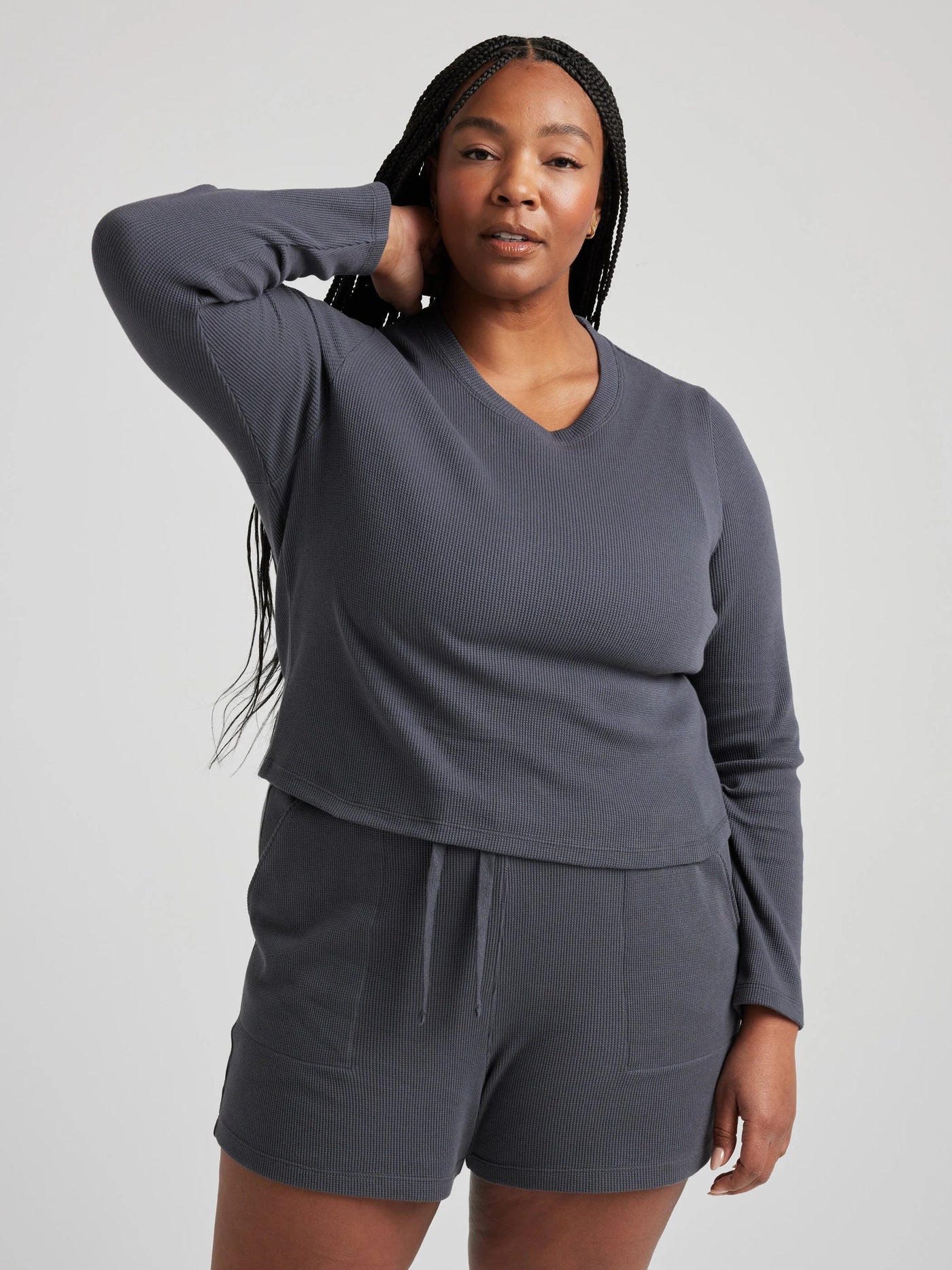 model wears organic thermal long sleeve in grey