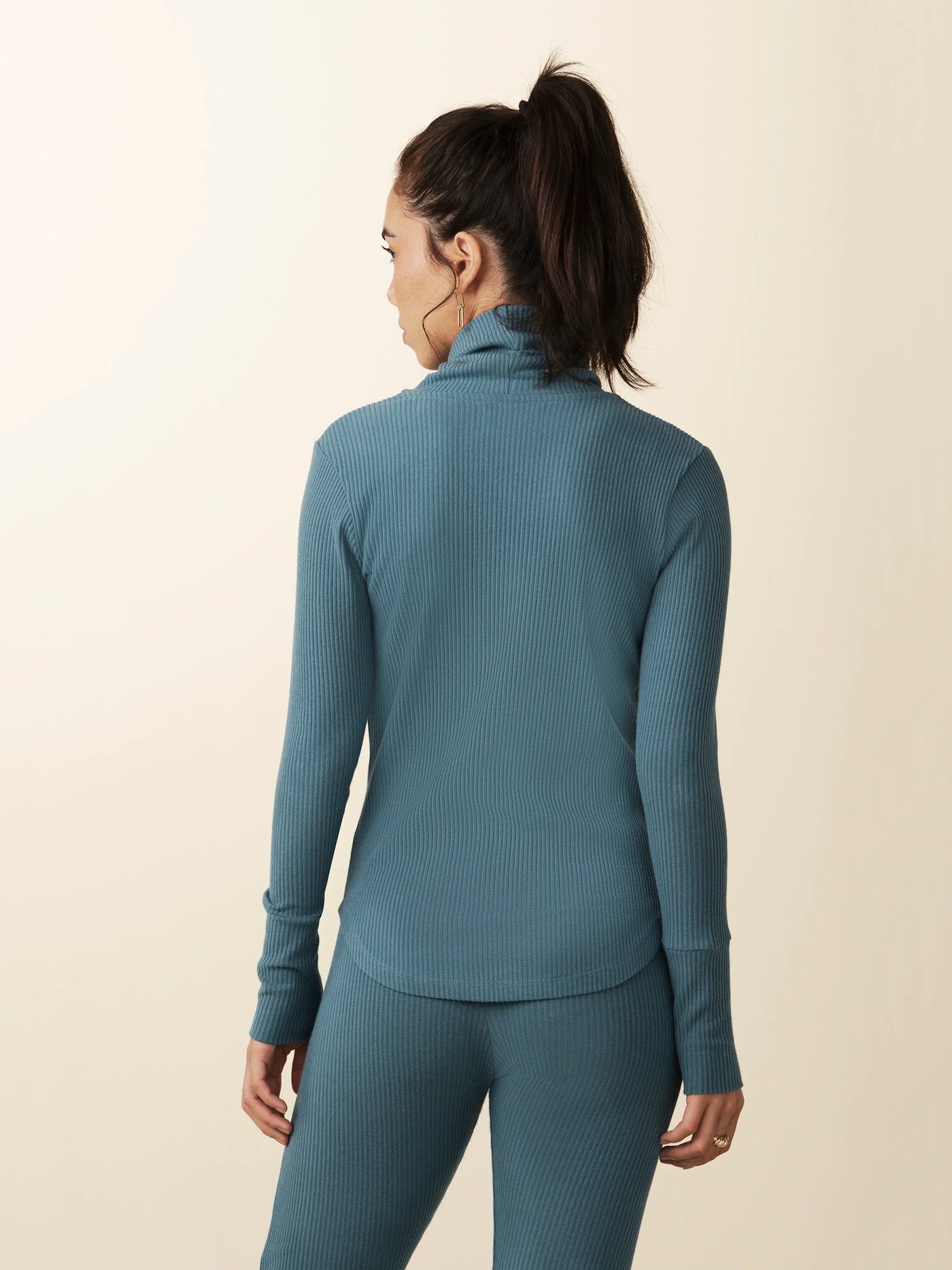 model wears cozy cowl turtleneck rib sweater in teal