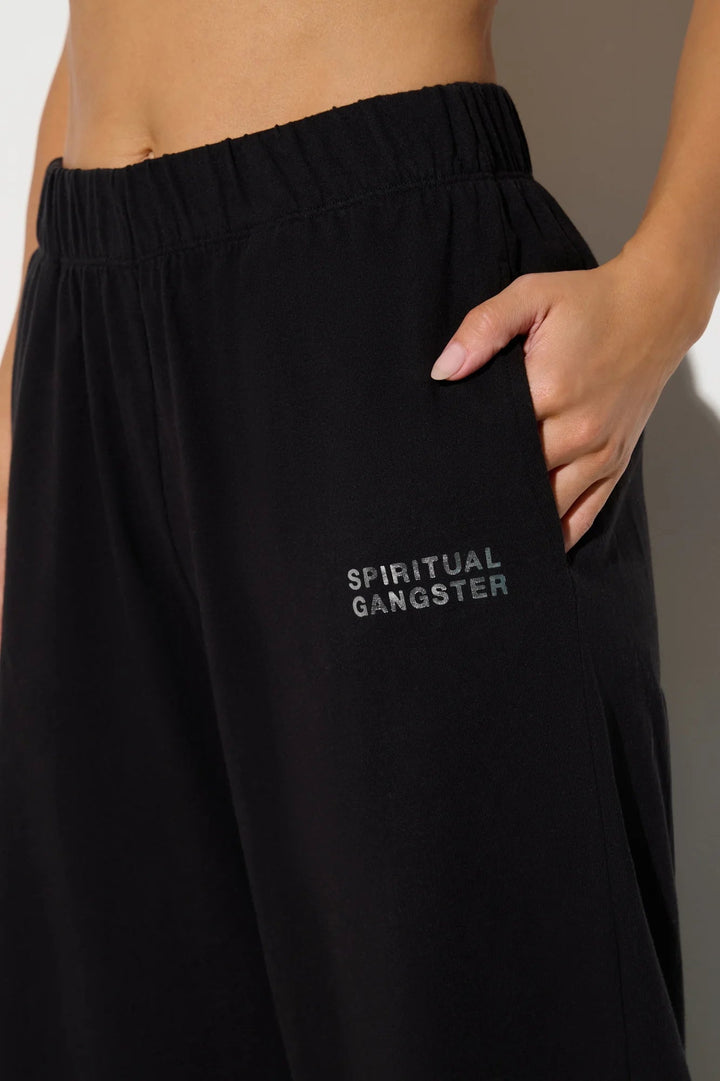 Close-up of Spiritual Gangster logo on Canyon Lightweight Cotton Sweatpants in Black