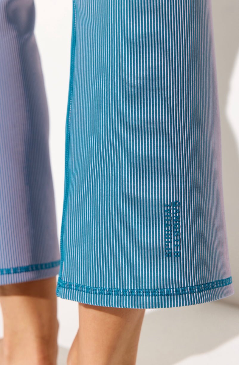 Close-up of ribbed fabric on Spiritual Gangster Auralight Rib 3/4 Slim Flare Yoga Pants in Blue Lagoon